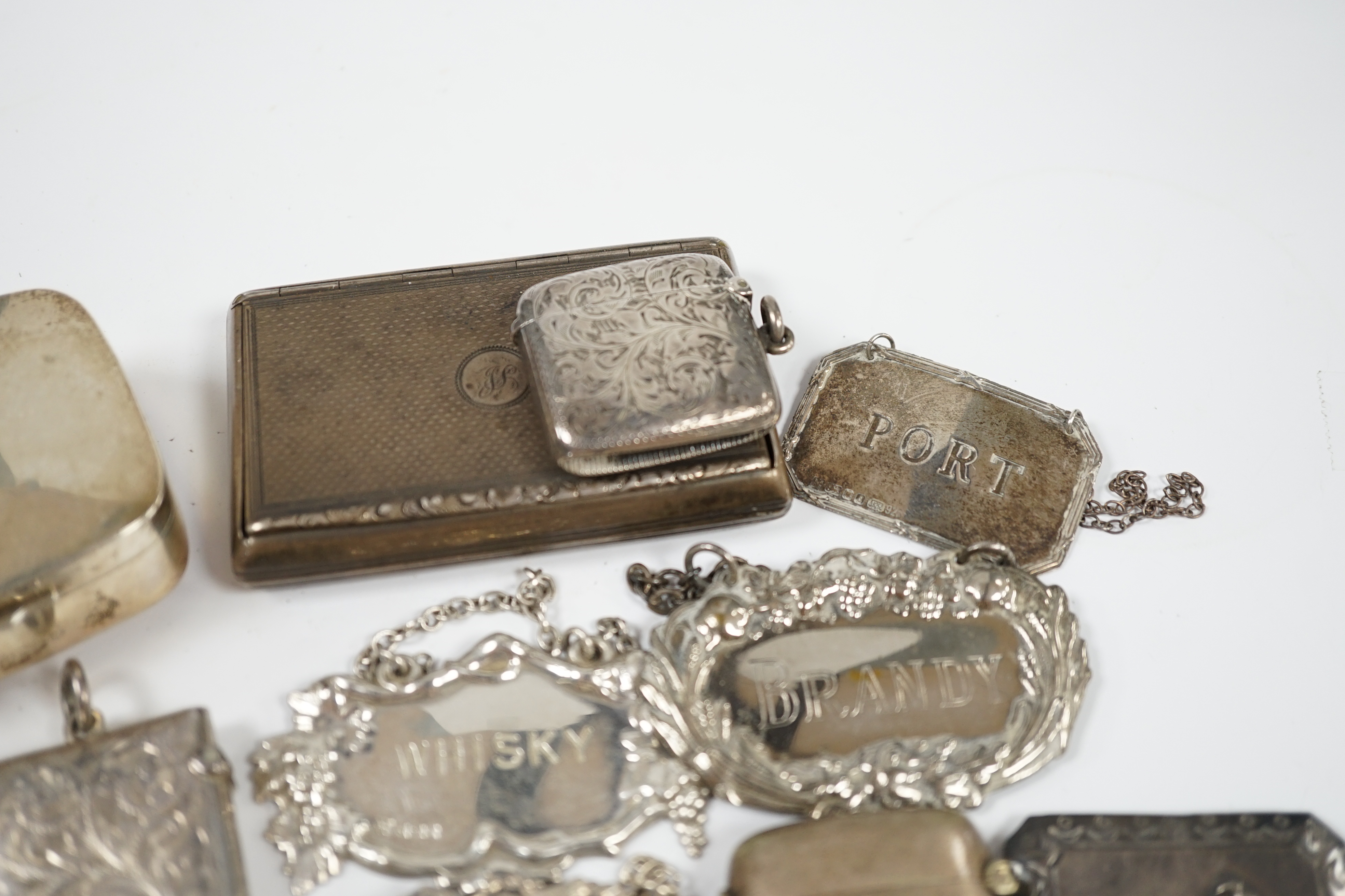 Sundry small silver and plated items including wine labels, vest cases, sovereign case and a Victorian silver snuff box, London, 1841, 79mm. Condition - poor to fair to good